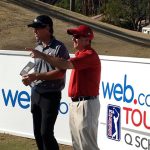 NIU Coach Tom Porten assesses options with Jake Scott during practice round