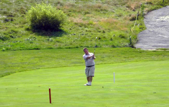 Dave Trier hits his second shot to the 15th green in the first round of the 2014 Chippewa Championship