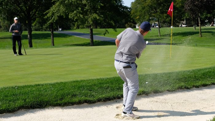 A player hits a bunker shot in Round 1 of the 2017 Kiely Cup