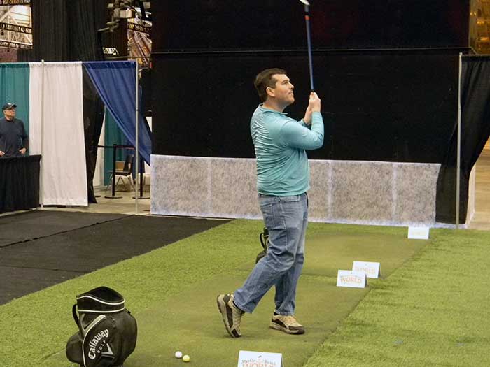 Chris Horne hits a shot at the hole in one contest at the 2018 Cleveland Golf Show