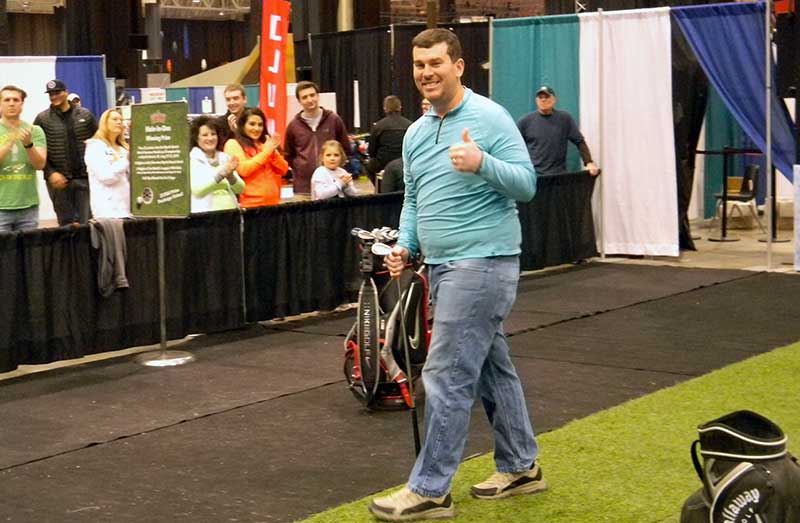 Chris Horne gives the thumbs up after hitting a shot to 5 inches at the Cleveland Golf Show.