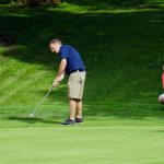 Dave Oates rolls a putt at the second as partner Vaughn Snyder watches in the 2019 Ungvary Memorial at Good Park.