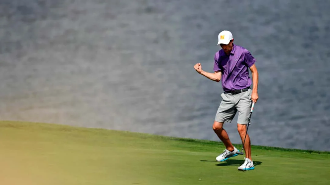 Brandon Pluchinsky fist-pumps after birdie at the last.