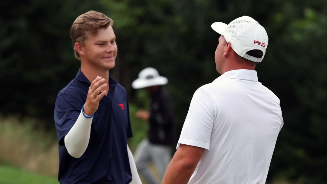 Kreusch + Wilson handshake
