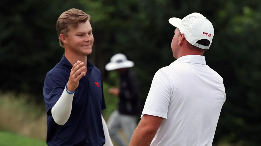 Kreusch + Wilson handshake